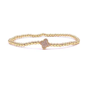 Ashley Gold Stainless Steel Gold Plated Center CZ Encrusted Flower Design Stretch Beaded Bracelet