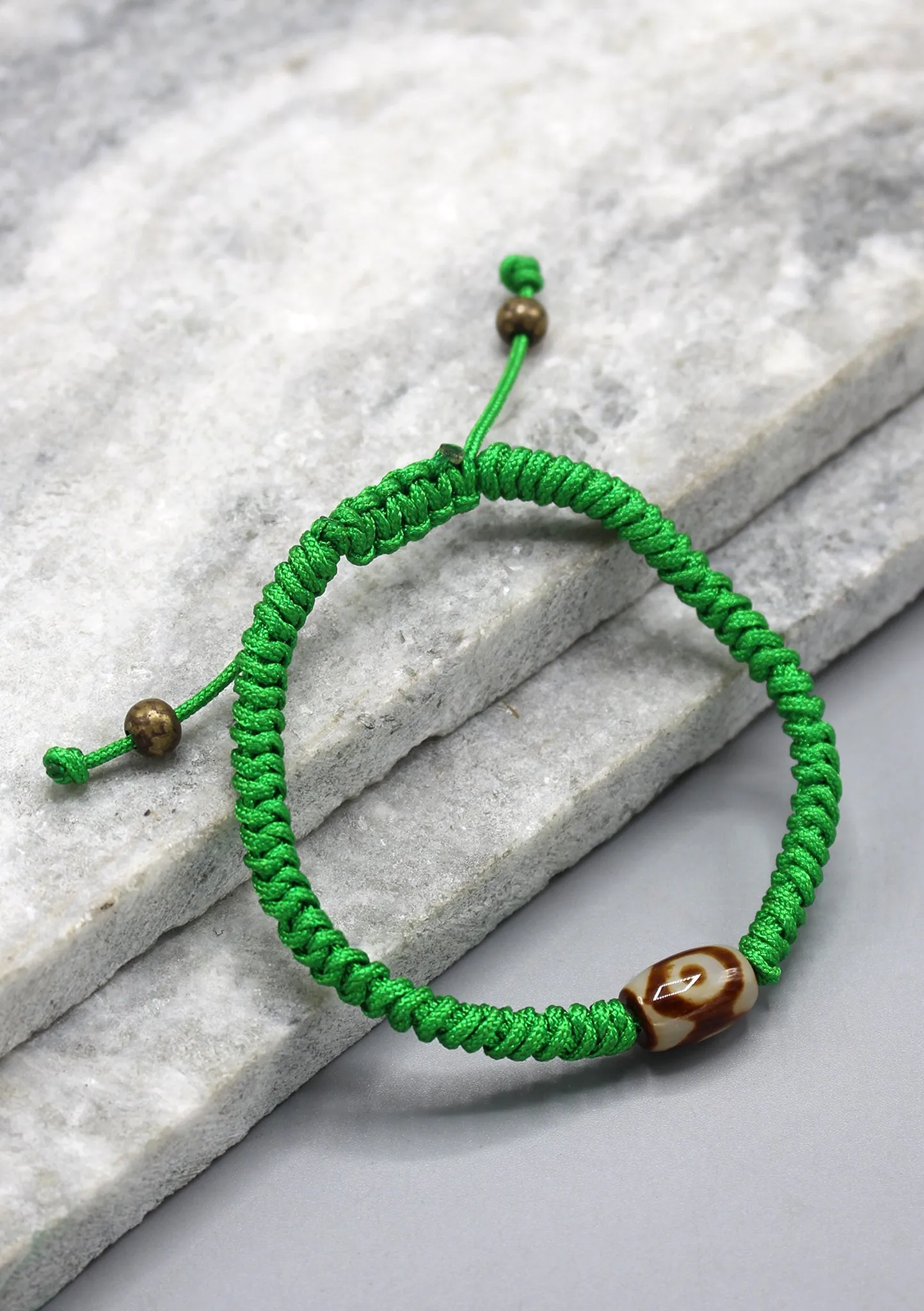 Dzi Bead on Green Lucky Knots Bracelet