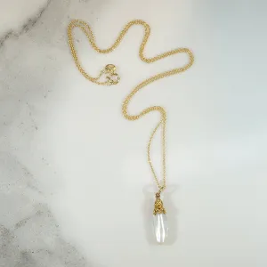 Glossy Baroque Pearl Pendant Crowned in Gold