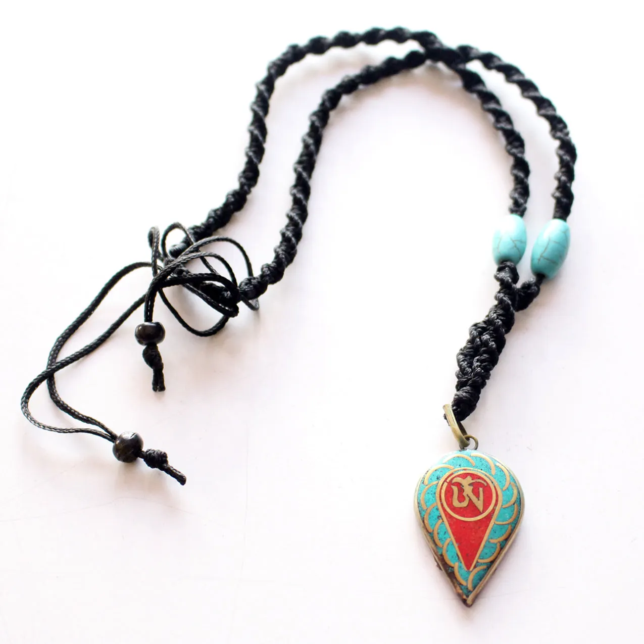 Turquoise and Coral Inlaid Leaf Tibetan Om Pendant